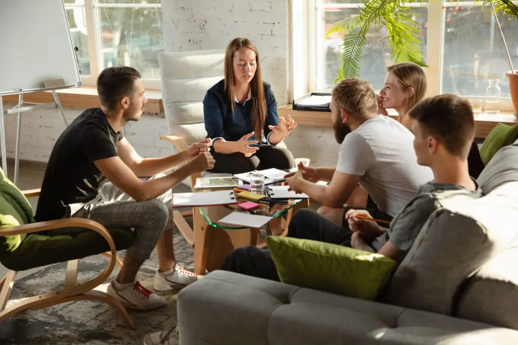 group of young caucasian office workers have creative meeting to discuss new ideas