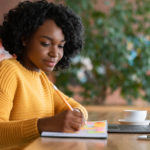motivated afro woman looking for new job online